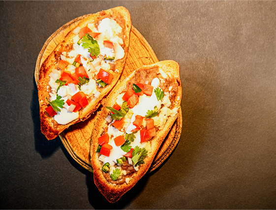 mexican-molletes-traditional-food-with-bread-beans-cheese-tomato-chili